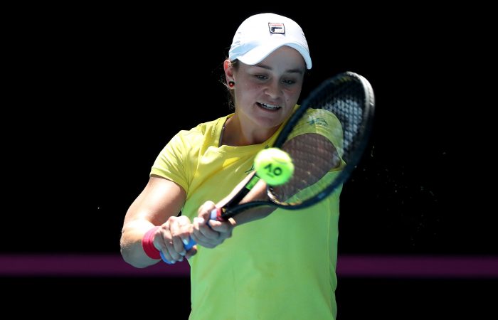 SMILES ALL ROUND: Ash Barty on the practice court. Picture: Getty Images