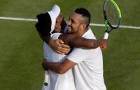 Venus Williams and Nick Kyrgios embrace after scoring a first-round mixed doubles win at Wimbledon. Picture: Getty Images