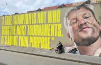 Dylan Alcott in front of his Melbourne mural. Picture: Instagram