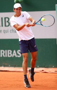PARIS, FRANCE - JUNE 06: Philip Sekulic of Australia plays a backhand during his Boy's Singles first round match against Juncheng Shang of China on day eight of the 2021 French Open at Roland Garros on June 06, 2021 in Paris, France. (Photo by Julian Finney/Getty Images)