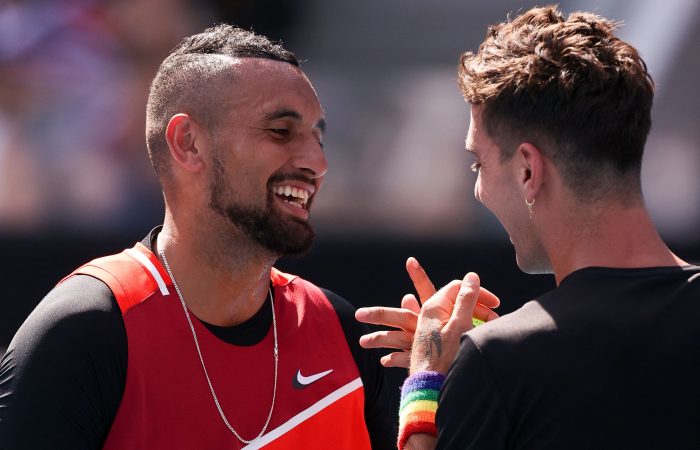 Australia's Nick Kyrgios (L) and Australia's Thanasi Kokkinakis talk before they play against Uruguay's Ariel Behar and Ecuador's Ariel Behar during their men's doubles match on day seven of the Australian Open tennis tournament in Melbourne on January 23, 2022. - -- IMAGE RESTRICTED TO EDITORIAL USE - STRICTLY NO COMMERCIAL USE -- (Photo by Martin KEEP / AFP) / -- IMAGE RESTRICTED TO EDITORIAL USE - STRICTLY NO COMMERCIAL USE -- (Photo by MARTIN KEEP/AFP via Getty Images)