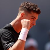 Thanasi Kokkinakis of Australia celebrates after winning the second set against Daniel Evans of Great Britain at Roland Garros; Getty Images
