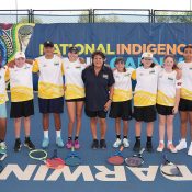 Evonne Goolagong Cawley poses with children at the Darwin International Tennis Centre for the National Indigenous Tennis Carnival on Thursday, August 10, 2023. (Tennis Australia/ SCOTT BARBOUR)