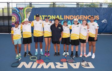 Evonne Goolagong Cawley poses with children at the Darwin International Tennis Centre for the National Indigenous Tennis Carnival on Thursday, August 10, 2023. (Tennis Australia/ SCOTT BARBOUR)
