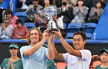 Australian doubles pair Rinky Hijikata (R) and Max Purcell hold the champion trophy during the awards ceremony of the men's doubles final against Jamie Murray of Britain and Michael Venus of New Zealand at the ATP Japan Open tennis tournament in Tokyo on October 22, 2023. (Photo by Kazuhiro NOGI / AFP) / 
