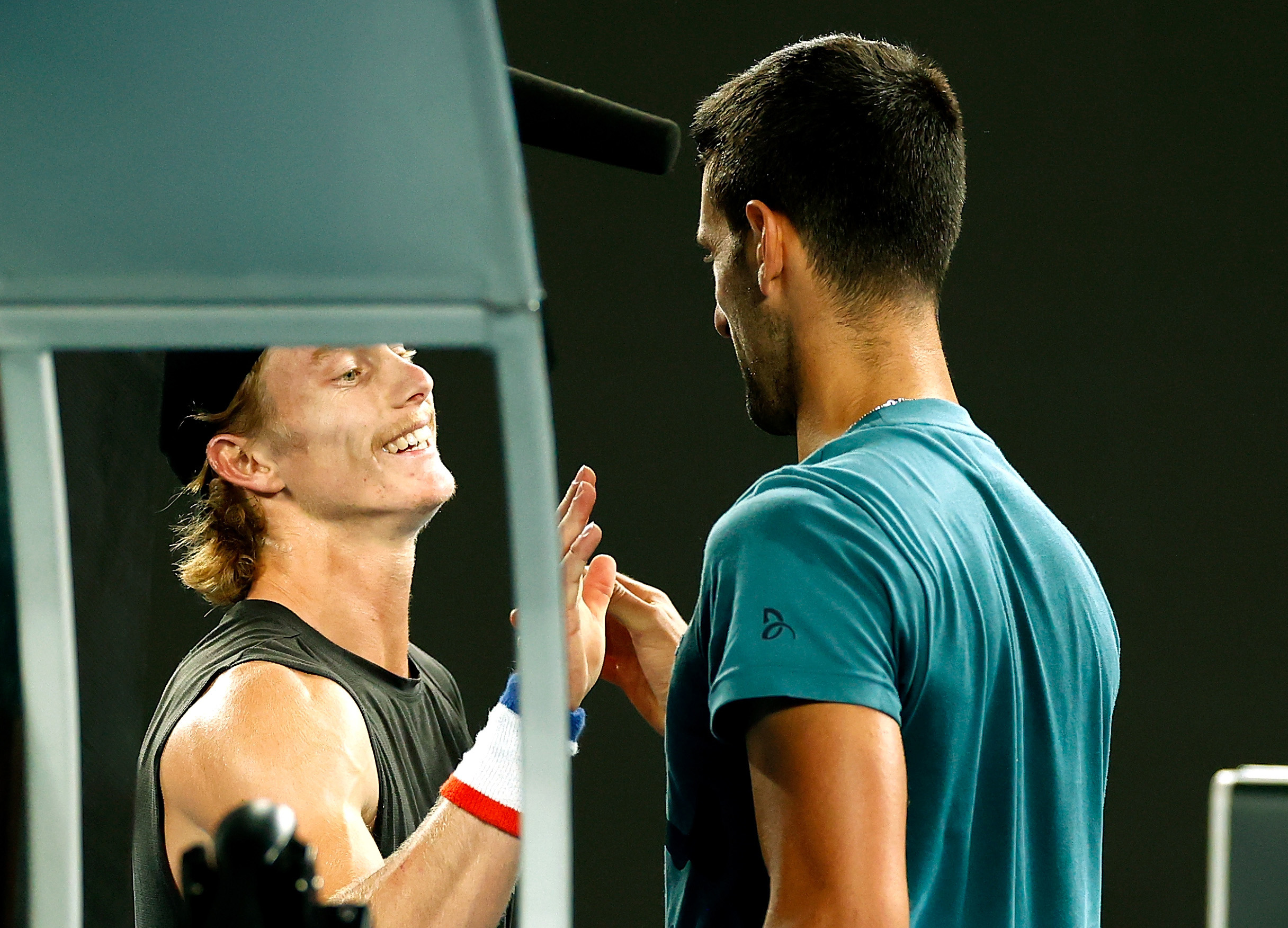 Dane Sweeny and Novak Djokovic embrace after a practice session at Australian Open 2024. Picture: Tennis Australia